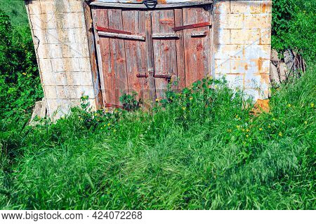 Wooden Door Of Old Cellar . Wine Store From Ancient . Abandoned Antique Construction