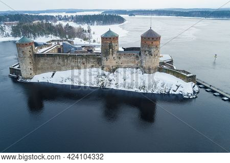View Of The Ancient Olavinlinna Fortress (olafsborg) Of Savonlinna City On A Cloudy March Day. Finla