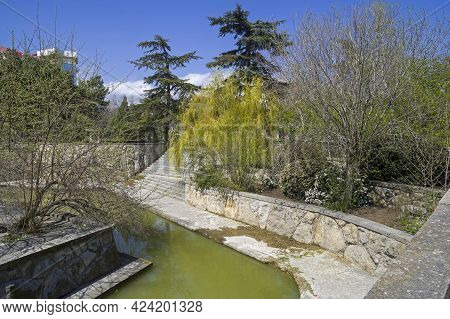 Sudak, Crimea - April 28, 2021: A Pond In The Park Of The Tourist And Recreation Center 
