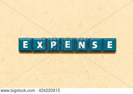 Tile Alphabet Letter In Word Expense On Wood Background