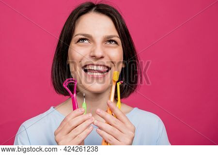 Beautiful Young Woman Uses An Oral Care Kit Consisting Of A Tongue Scraper, Single Tufted And Interd