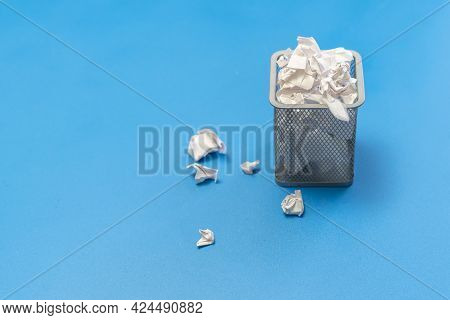 Bunch Of Crumpled Paper Balls In The Metal Rubish Bin Urn Basket On The Colorful Background