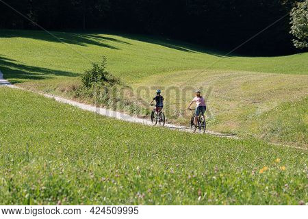 Two Girls On Mtb Bikes. Mother And Daughter Riding On A Forest Trail.