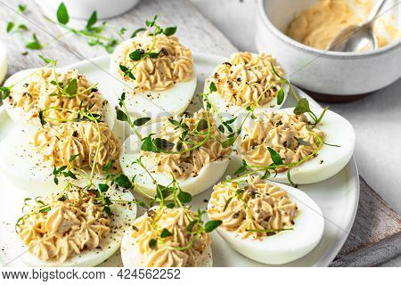 Deviled eggs on a white plate