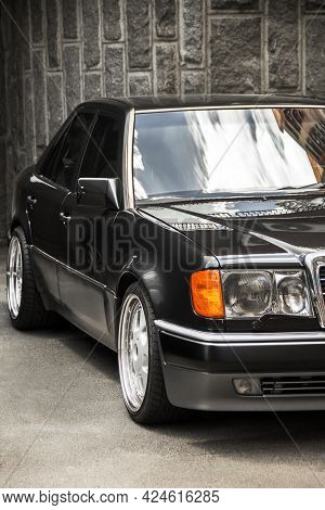 Kiev, Ukraine - June 12, 2021: Gray Mercedes E500 W124 Wolf Parked In The City