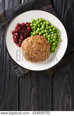 Veal Burger With Green Peas And Lingonberry Jam Close-up In A Plate On The Table. Vertical Top View 