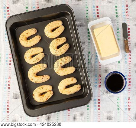 Chipas, Typical South American Cheese Bun In A Baking Tray With Butter And Coffee.