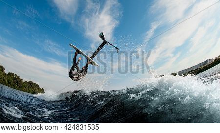 Amazing View Of Man Effectively Performs Trick Over The Wave With Foilboard