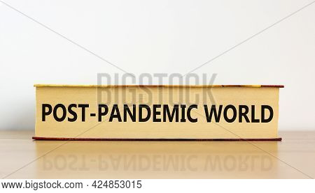 Covid-19 Post-pandemic World Symbol. Concept Words 'post-pandemic World' On Book On Wooden Table. Be