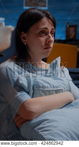 Traumatised, Frustrated, Stressed, Depressed Woman With Black Stares Sitting Alone Holding Pillow Fe
