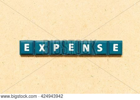 Tile Alphabet Letter In Word Expense On Wood Background