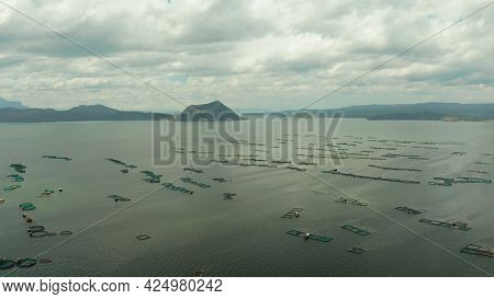 Taal Volcano On An Island In Middle Lake With Fish Farm, Aerial View. Luzon, Philippines Tropical La