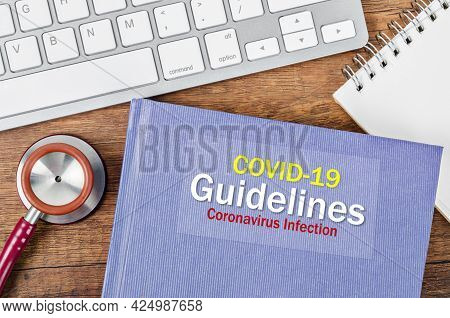 Covid-19 Guidelines, Coronavirus Infection Book With Stethoscope Medical. Medical Concepts.