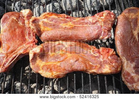 Close shot of hot fresh meat on grill
