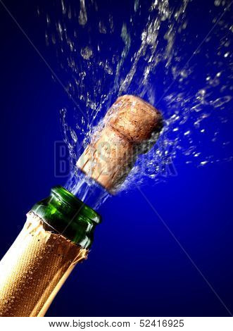 Close up of champagne cork popping
