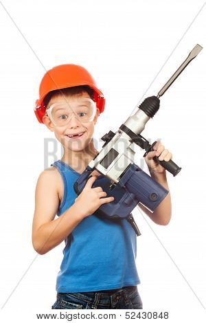 little boy in a helmet with electric hammer