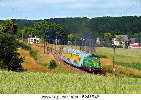 Passenger Train Passing The Countryside