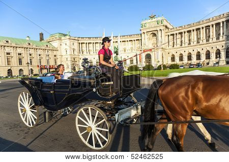 People Have A Ride In The Horsedrawn Carriage Called Fiaker