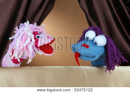 Puppet show on brown background