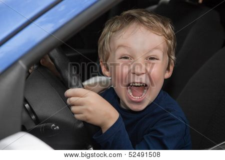 Boy Driving A Car