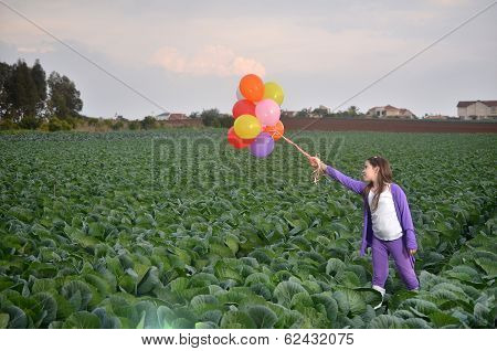 A Teenage Girl In Purple With Colorful Balloons