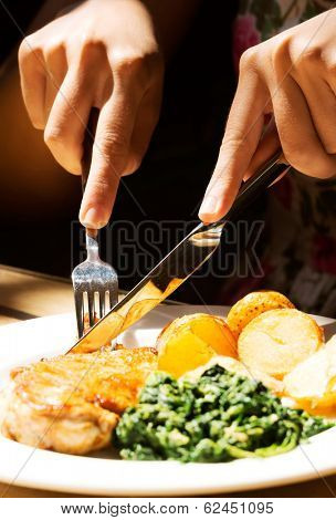 Picture of palte and food cut with cuterly. In a restaurant.