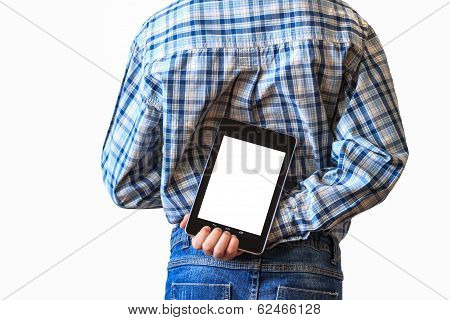close up of boy holding tablet computer behind his back