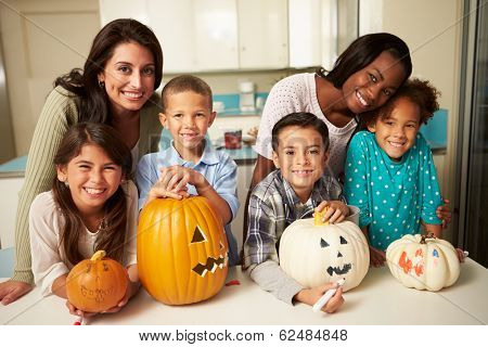 Mothers And Children Making Halloween Lanterns