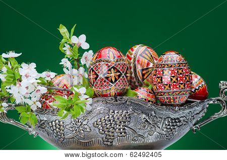 Beautiful red easter egg against green gackground