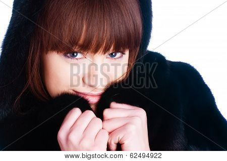 Young woman in fur coat