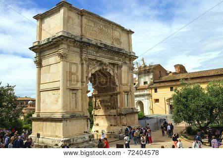 Tourists In Square Near The Triumphal Arch Of Titus In Rome, Italy
