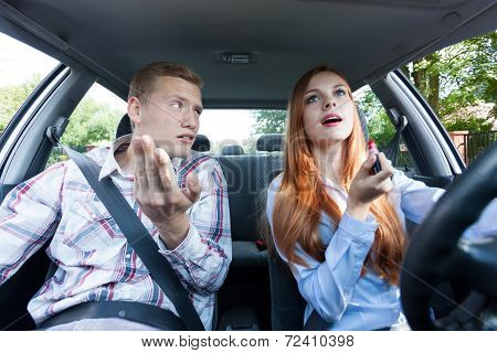 Frivolous Woman Making Up In Car