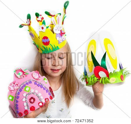Little girl demonstrating her cruft works, Easter bonnets