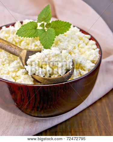 Curd In Wooden Bowl With Spoon On Board