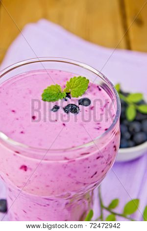 Milkshake With Blueberries In Glass On Board