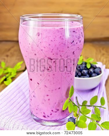 Milkshake With Blueberries And Napkin On Board