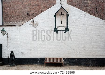 Bench And Crucifix In The Beguinage  Belgium