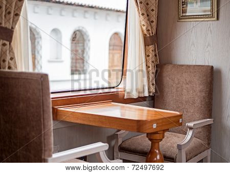 Chairs and table inside a train wagon