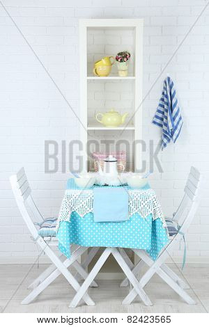 Wooden chairs and table in cozy kitchen