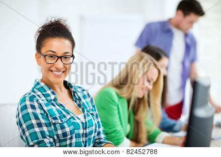 education concept - student with computer studying at school