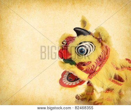 chinese traditional dancing lion on Old antique vintage paper background