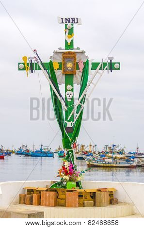 PARACAS, PERU, MAY 22, 2014: Decorated cross in port of Paracas