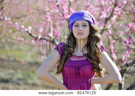 young beautiful woman portrait on field in summer