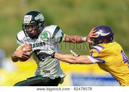 VIENNA, AUSTRIA - JULY 14 QB Jonathan Dally (#8 Dragons) and DB Benjamin Bubik (#4 Vikings) fight for the ball at the playoffs of the AFL on July 14, 2013 in Vienna, Austria.