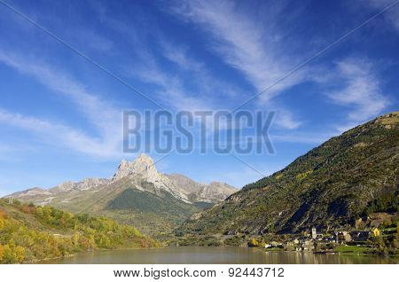 rocky peak near a lake village in the Pyrenees, Lanuza, Huesca, Aragon, Spain.
