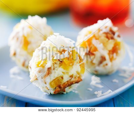 tropical cheese balls with dried fruit and coconut flakes