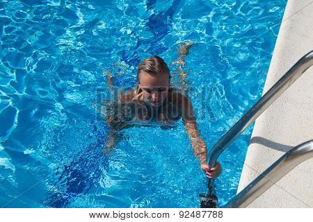 Sexy Girl In Bikini Swimms In Swimming Pool.