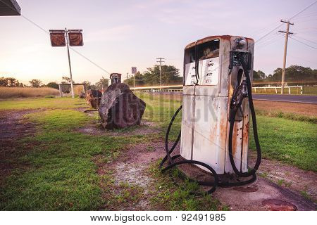Old rustic pump at an abandoned fuel station