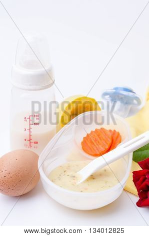 Fresh various kinds of baby food in plastic bowls. Shot for a story on homemade organic healthy baby foods.