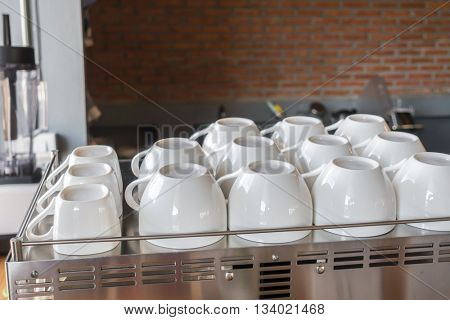 Empty coffee cup on coffee machine
